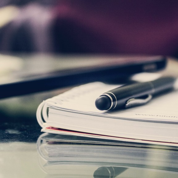 Pen and paper on a desk